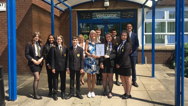 Staff and pupils from Stoke High Ormiston Academy School with their QICS Award