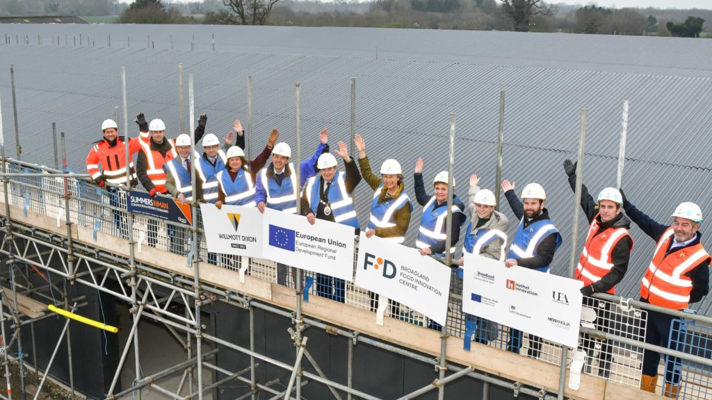 People in high-vis jackets and hard hats at the topping out of Broadland Food Innovation Centre