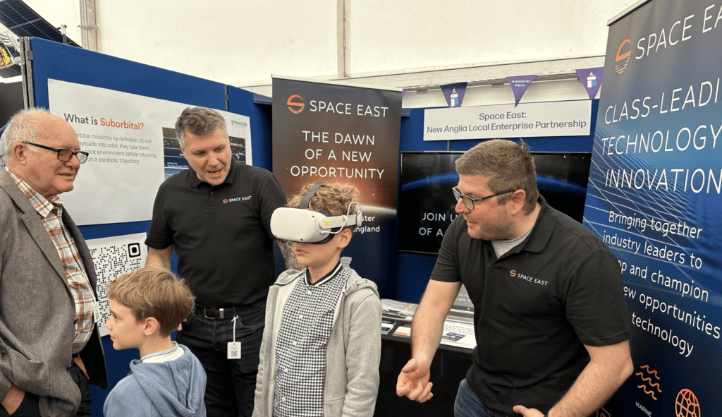 Young person being shown virtual reality technology at Suffolk Show
